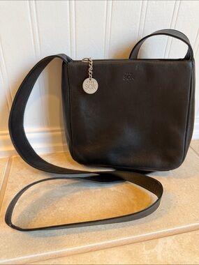 The Sak Black Leather Crossbody with Silver Charm